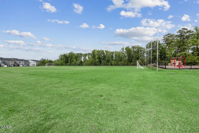 a living room with furniture a fireplace and a table