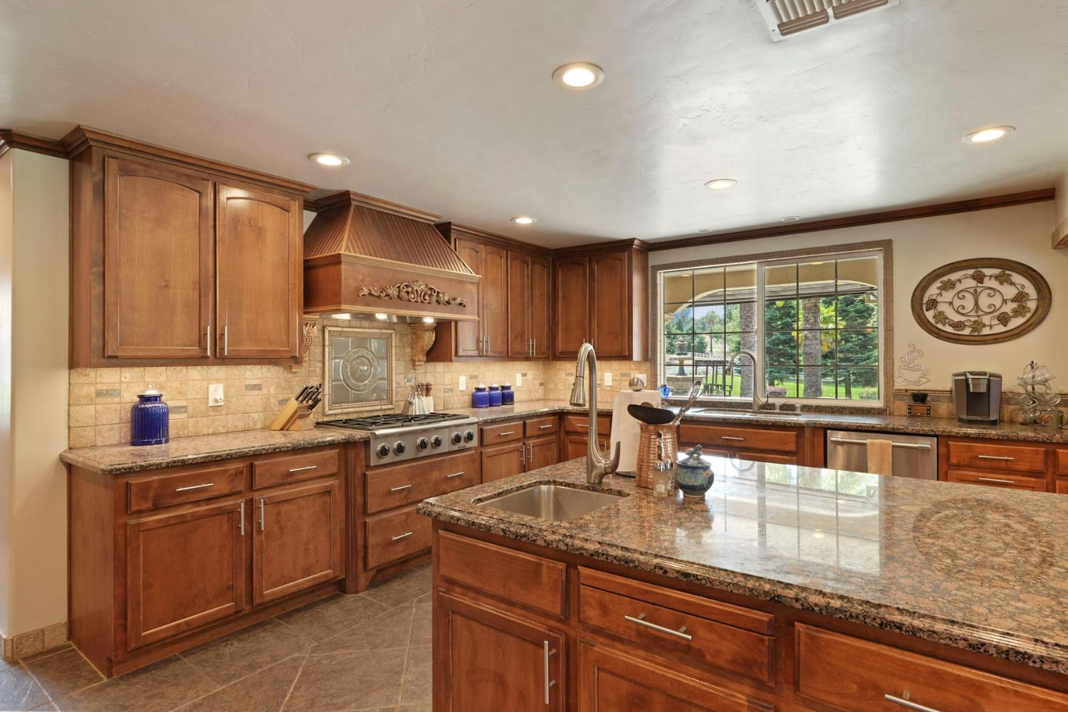 5407 Butler Road Penryn, CA 95663 - Photo 11 of 69 a kitchen with a sink a window and stainless steel appliances