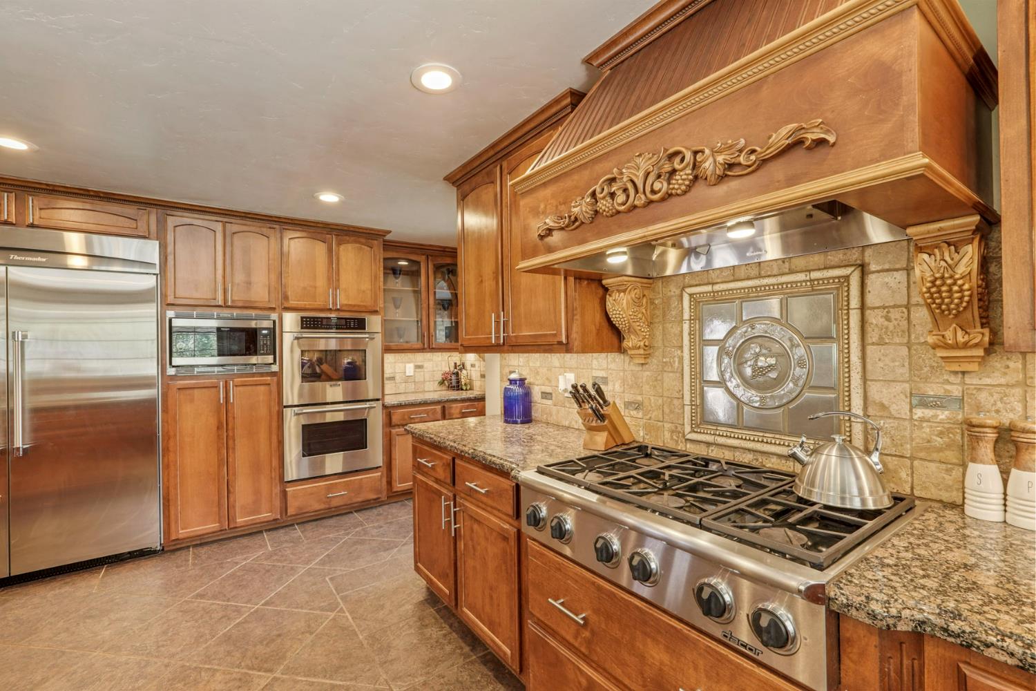 5407 Butler Road Penryn, CA 95663 - Photo 12 of 69 a kitchen with a stove and a refrigerator