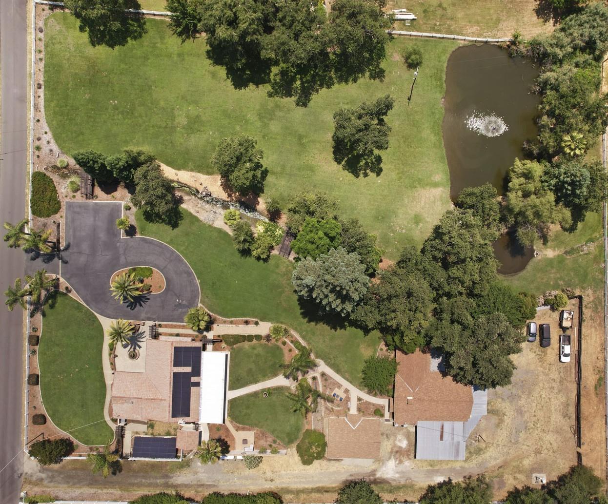 5407 Butler Road Penryn, CA 95663 - Photo 2 of 69 an aerial view of a house with a yard and lake view