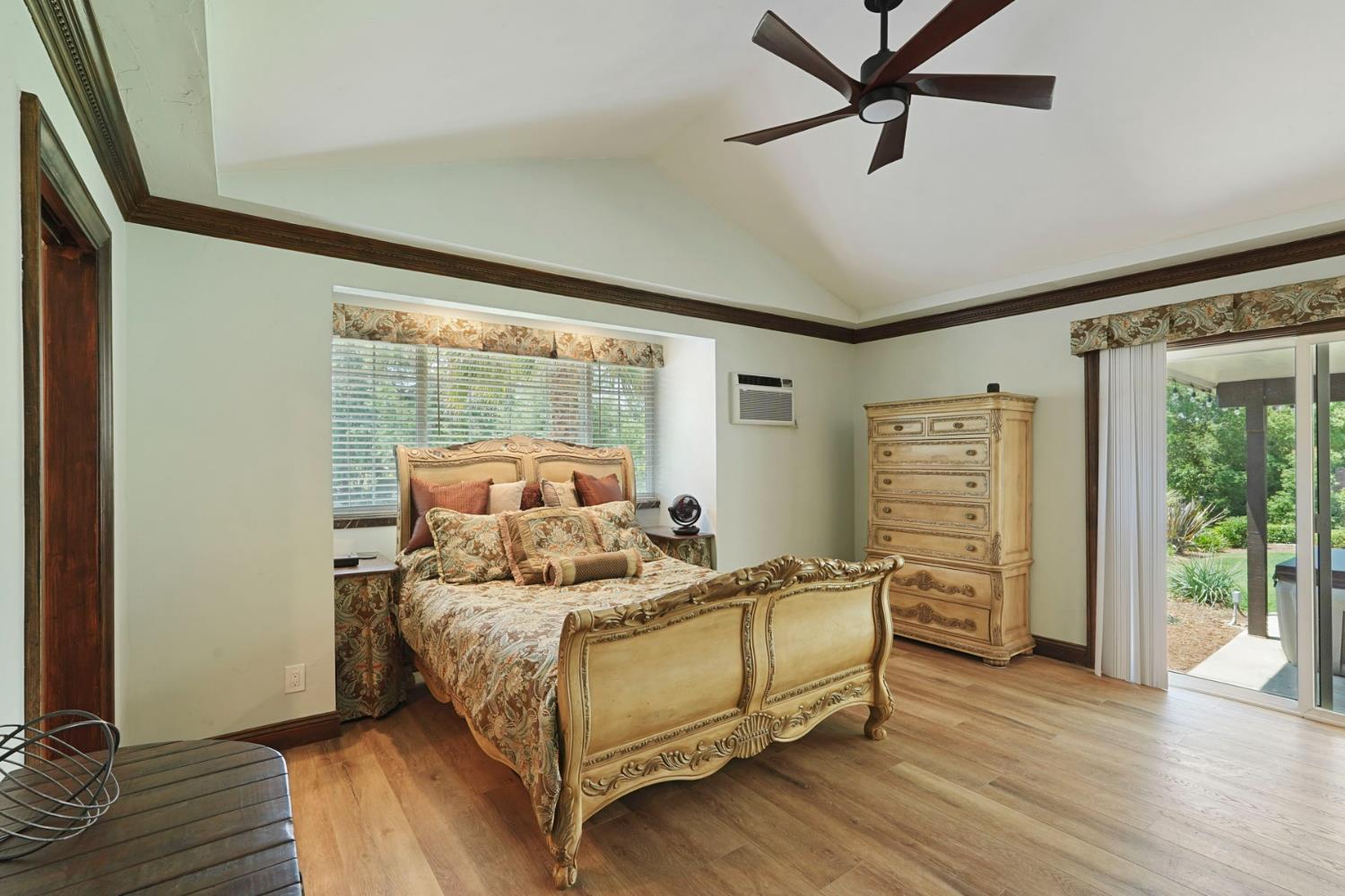 5407 Butler Road Penryn, CA 95663 - Photo 21 of 69 a bedroom with a bed and wooden floor