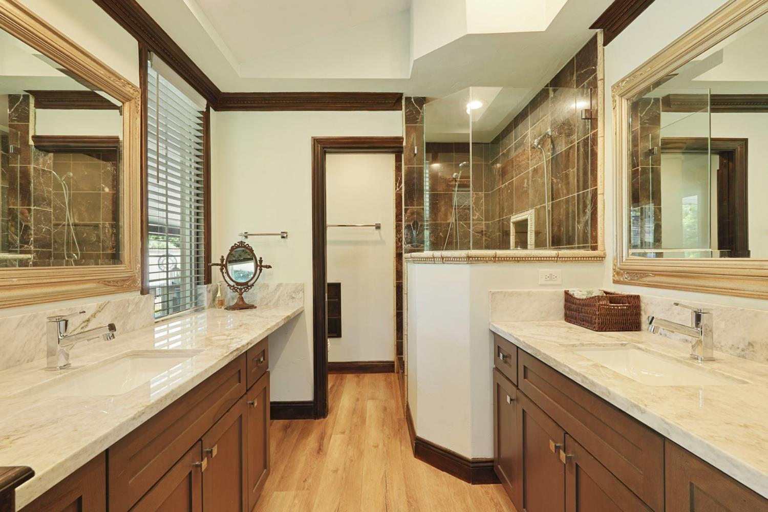 5407 Butler Road Penryn, CA 95663 - Photo 23 of 69 a bathroom with a granite countertop sink and a mirror