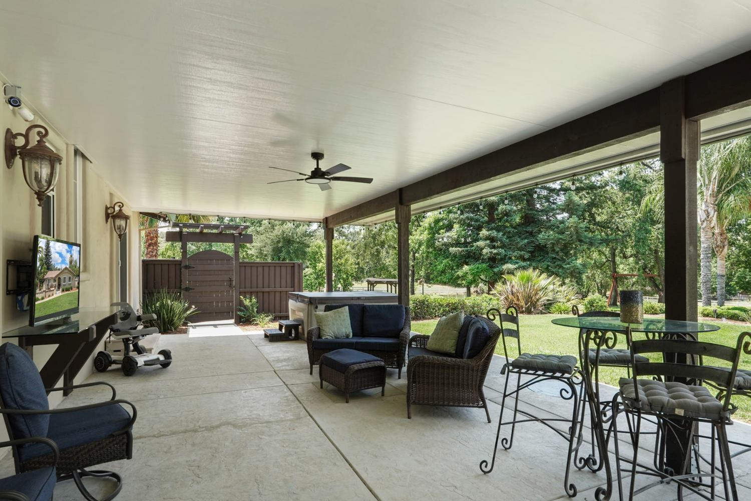 5407 Butler Road Penryn, CA 95663 - Photo 33 of 69 a living room with patio furniture and a floor to ceiling window