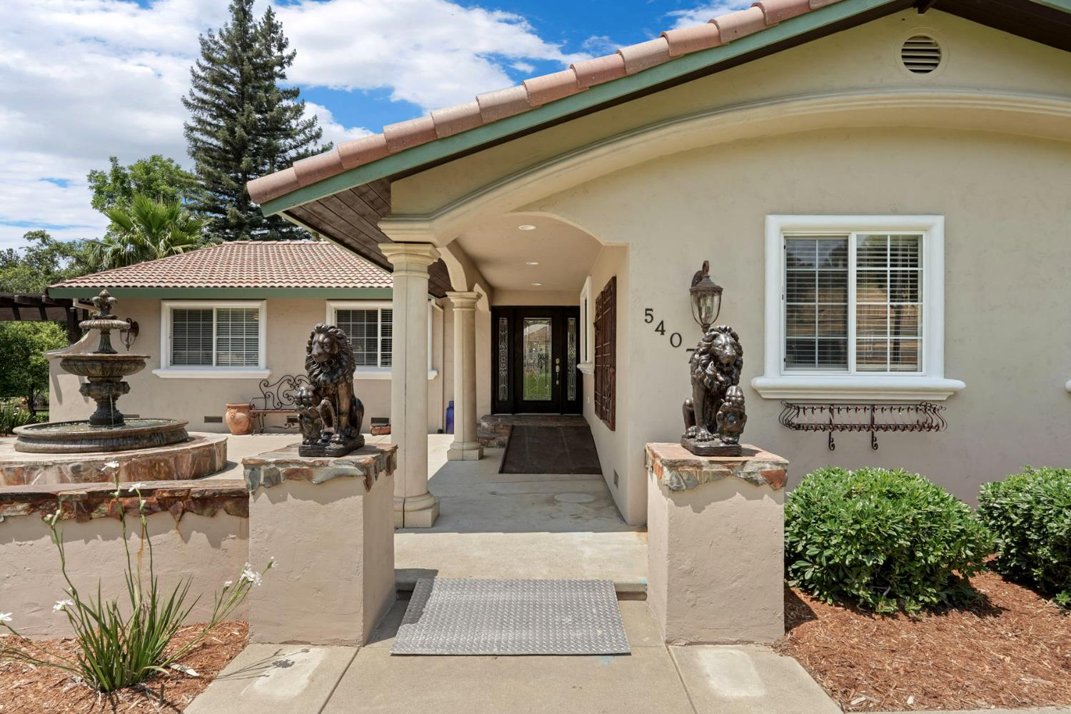 5407 Butler Road Penryn, CA 95663 - Photo 6 of 69 a view of a patio with couches table and chairs and potted plants