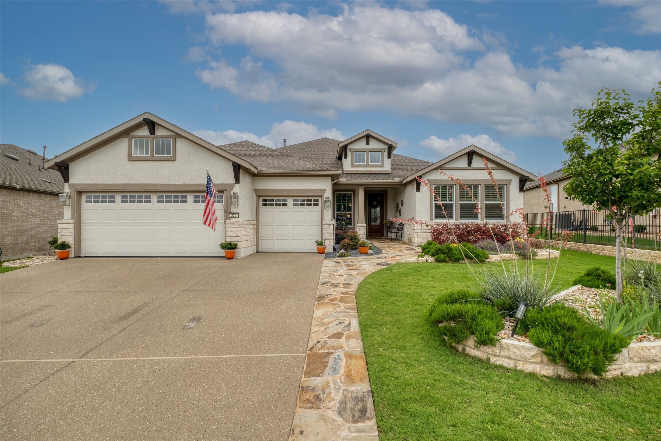 220 Fairway Ridge Road Georgetown, TX 78633 - Photo 1 of 1 Stucco & stone upgraded Magnolia floor plan with windows added to garage doors, custom light package & epoxy driveway, walkways & front porch with addition step out stones on side of driveway
