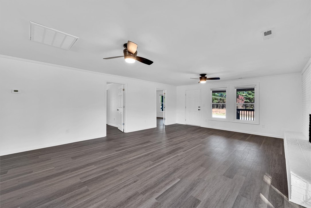 801 Cherokee Road Pelzer, SC 29669 - Photo 13 of 45 This bright and airy living space offers ample room for comfort and personalization.