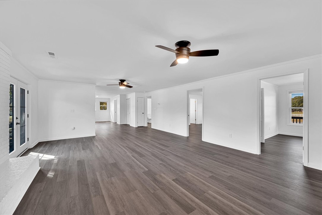 801 Cherokee Road Pelzer, SC 29669 - Photo 14 of 45 This expansive room offers a blank canvas for personalized living and features elegant flooring.