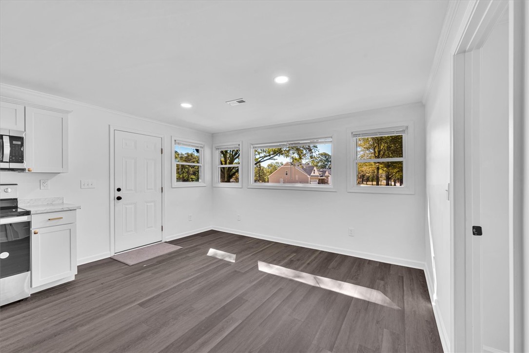 801 Cherokee Road Pelzer, SC 29669 - Photo 16 of 45 Bright and airy living space featuring modern flooring and ample natural light.