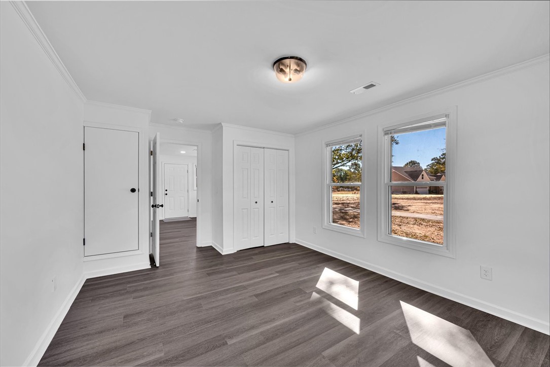 801 Cherokee Road Pelzer, SC 29669 - Photo 22 of 45 This bright room features durable flooring and ample natural light, ideal for comfortable living.