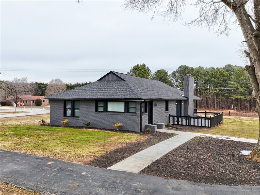 801 Cherokee Road Pelzer, SC 29669 - Photo 41 of 45 This charming home offers a serene escape with its inviting exterior and spacious yard.