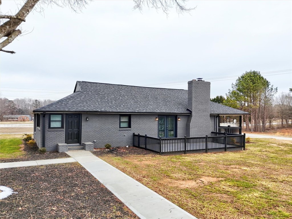801 Cherokee Road Pelzer, SC 29669 - Photo 42 of 45 This charming home features a lovely deck and a classic brick exterior, perfect for any lifestyle.