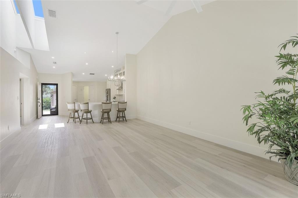 4004 Crayton Road Naples, FL 34103 - Photo 11 of 29 Beautiful open space with waterproof and extremely hardwearing Korlok flooring.