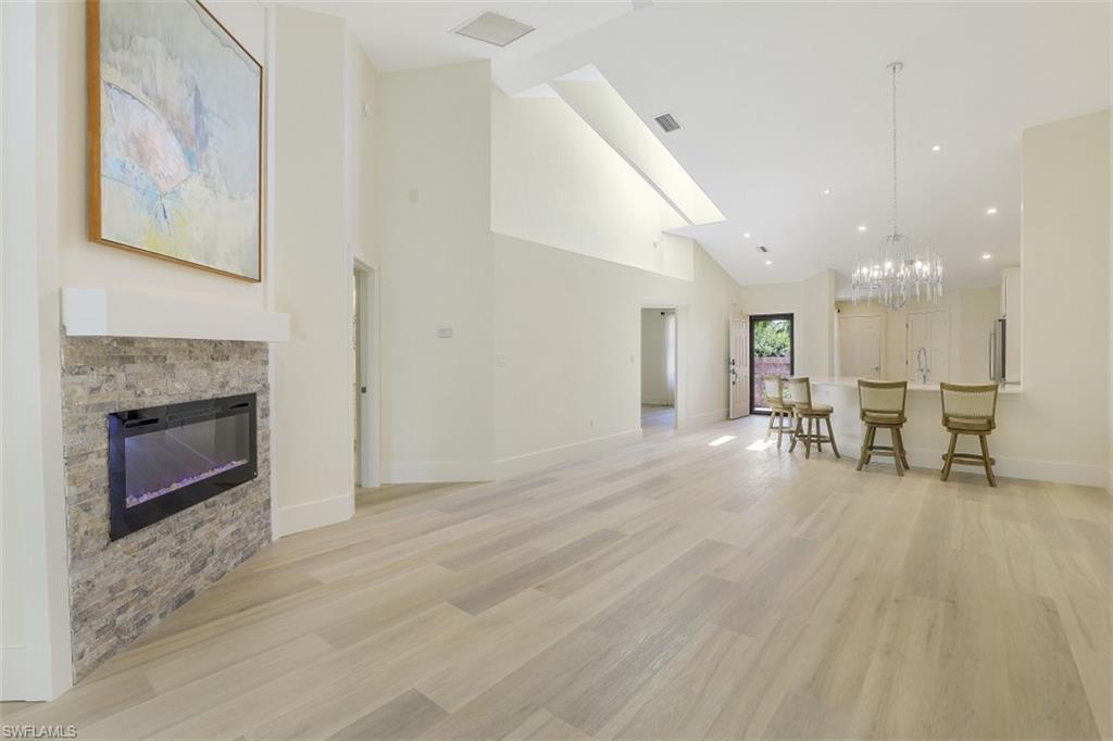4004 Crayton Road Naples, FL 34103 - Photo 12 of 29 Another angle of fireplace and living area.