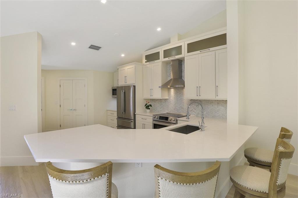 4004 Crayton Road Naples, FL 34103 - Photo 6 of 29 Breakfast bar for casual dining