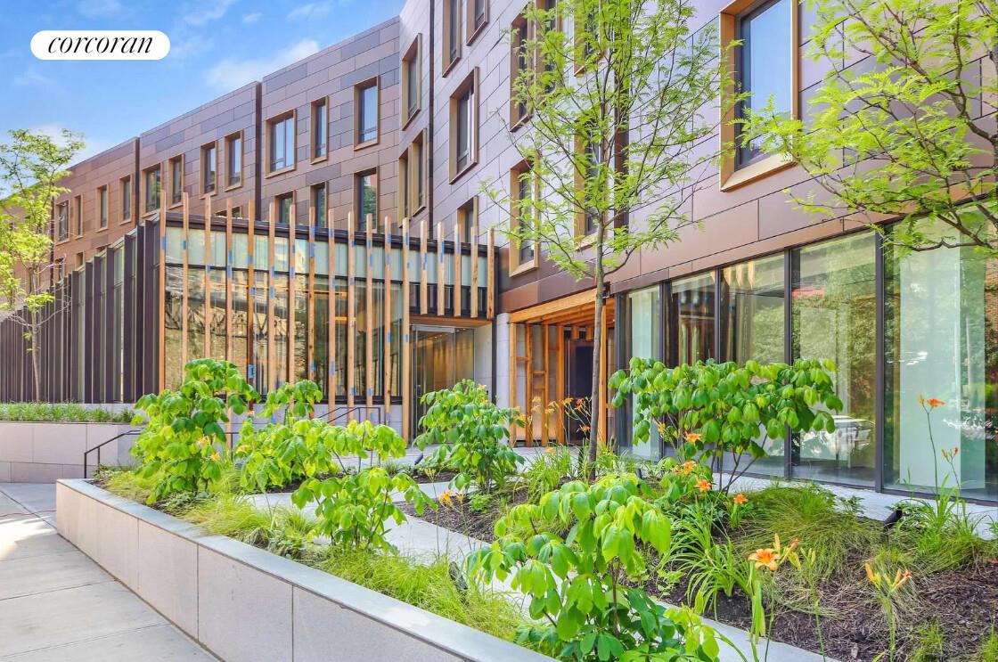 90 Furman Street, Unit N216 Brooklyn, NY 11201 - Photo 19 of 22 a view of a building with a garden