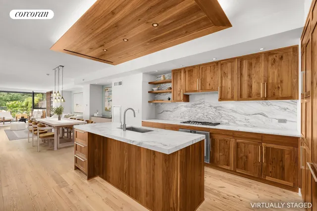 a balcony with furniture and a potted plant