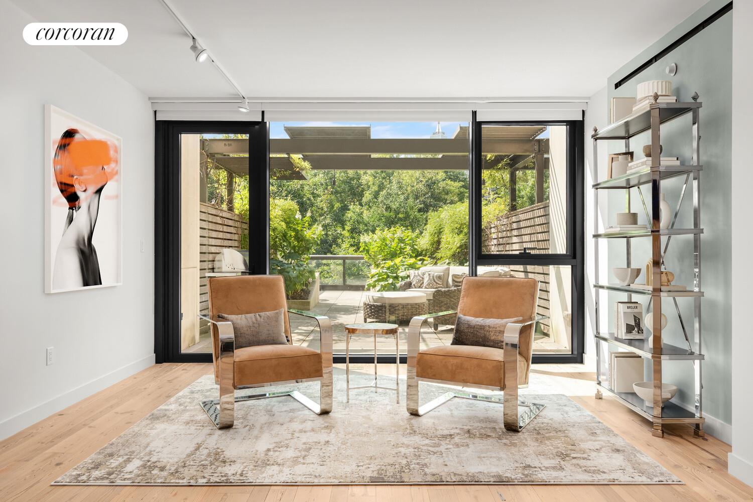 90 Furman Street, Unit N216 Brooklyn, NY 11201 - Photo 3 of 22 a living room with furniture and a large window