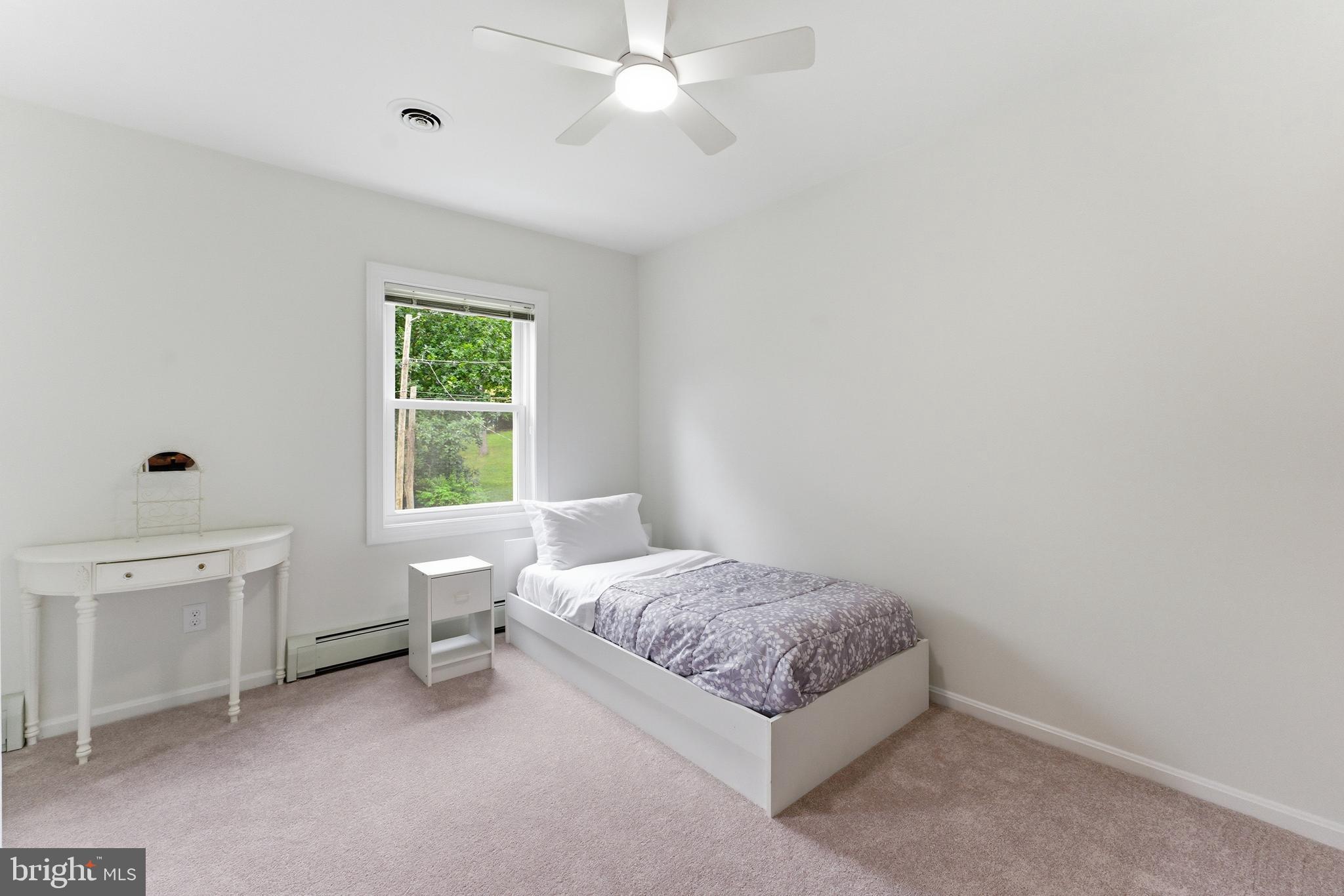 2100 Edgewater Parkway Silver Spring, MD 20903 - Photo 24 of 46 a bedroom with a bed and a window