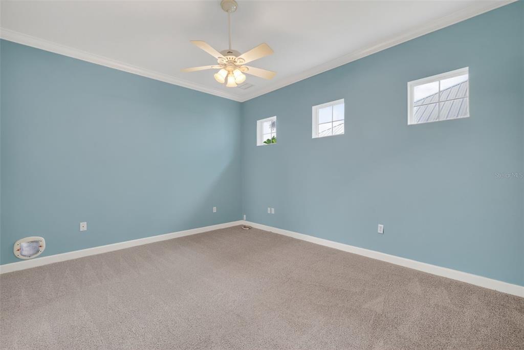 2117 Appalachee Circle Tavares, FL 32778 - Photo 12 of 30 a view of an empty room with a chandelier fan