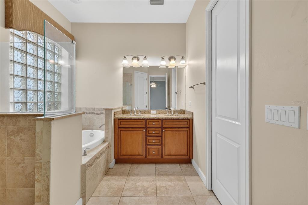 2117 Appalachee Circle Tavares, FL 32778 - Photo 13 of 30 a bathroom with a sink a vanity and a mirror