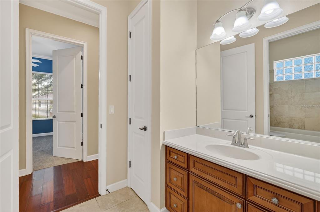 2117 Appalachee Circle Tavares, FL 32778 - Photo 22 of 30 a bathroom with a sink a vanity and a mirror