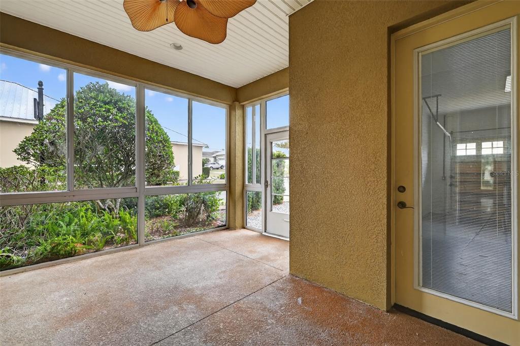 2117 Appalachee Circle Tavares, FL 32778 - Photo 23 of 30 a view of a porch with a floor to ceiling window