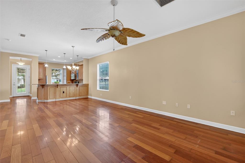 2117 Appalachee Circle Tavares, FL 32778 - Photo 4 of 30 a view of a room with wooden floor closet and windows