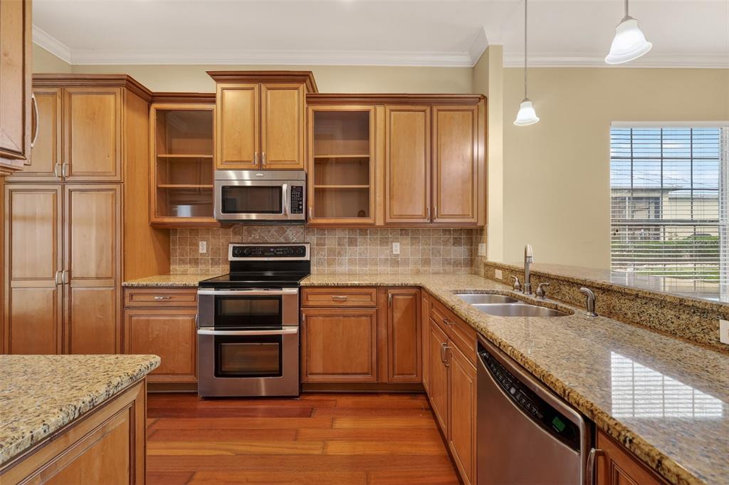 2117 Appalachee Circle Tavares, FL 32778 - Photo 5 of 30 a kitchen with a sink stove and refrigerator