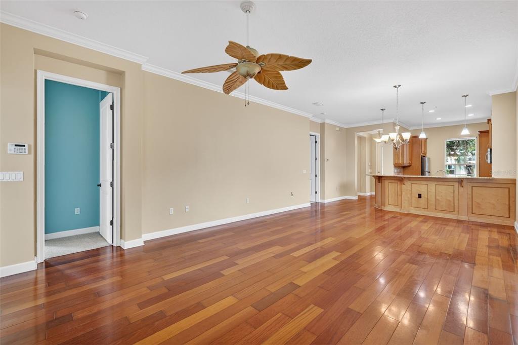 2117 Appalachee Circle Tavares, FL 32778 - Photo 9 of 30 an empty room with wooden floor and windows