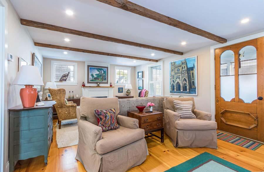 180 Commercial Street Wellfleet, MA 02667 - Photo 11 of 41 a living room with furniture and a large window