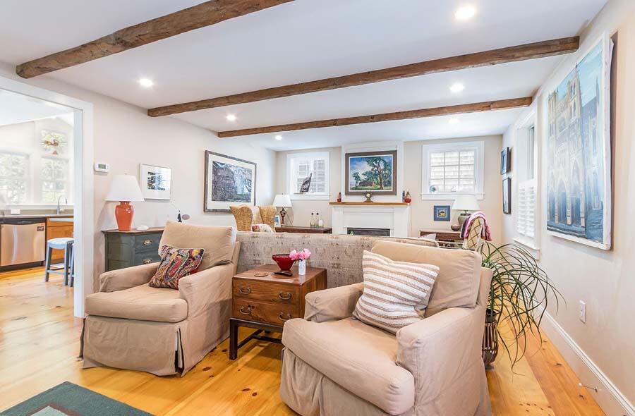 180 Commercial Street Wellfleet, MA 02667 - Photo 12 of 41 a living room with furniture and a large window