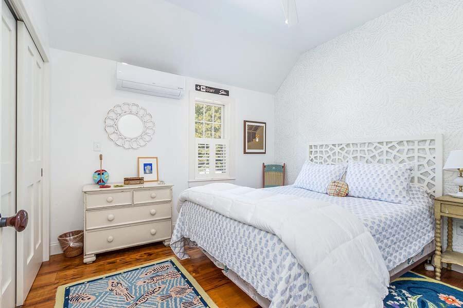 180 Commercial Street Wellfleet, MA 02667 - Photo 21 of 41 a bedroom with a bed and a window