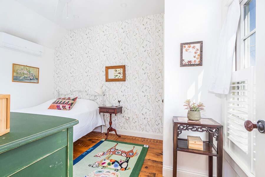 180 Commercial Street Wellfleet, MA 02667 - Photo 23 of 41 a bedroom with a bed and a dresser in it