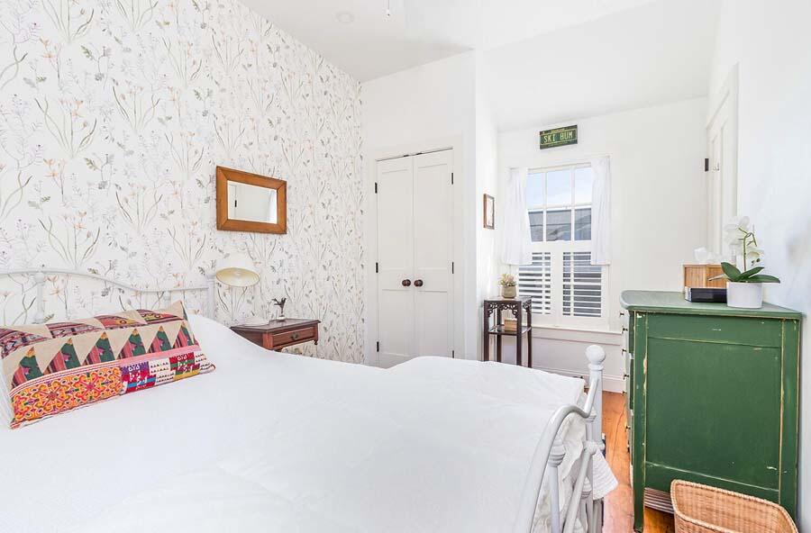 180 Commercial Street Wellfleet, MA 02667 - Photo 25 of 41 a bedroom with a bed and a window