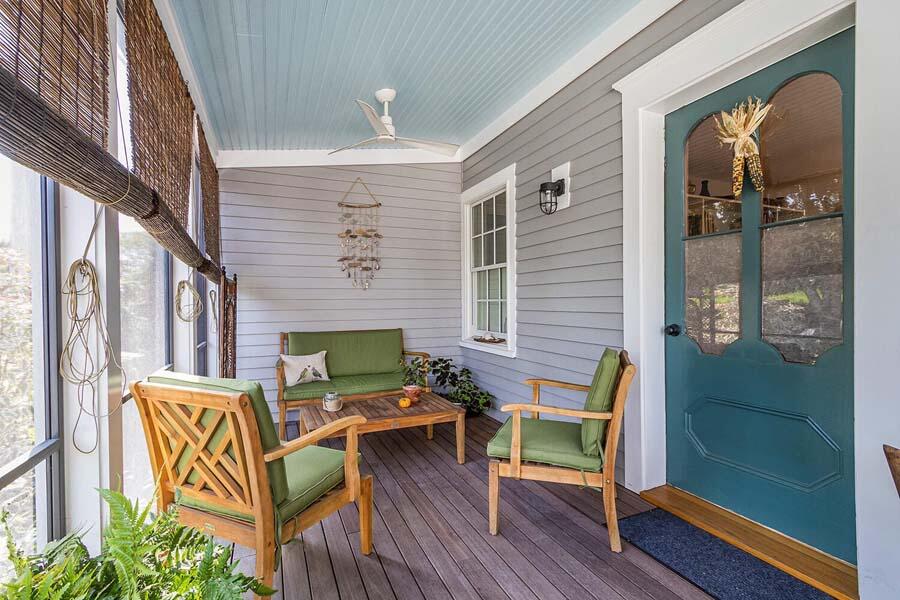 180 Commercial Street Wellfleet, MA 02667 - Photo 30 of 41 a balcony with furniture and wooden floor