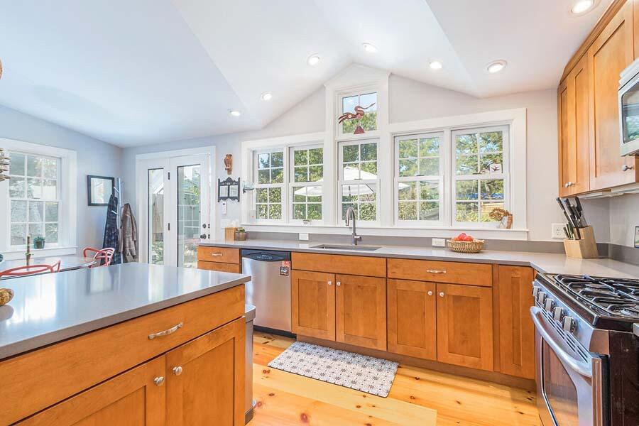 180 Commercial Street Wellfleet, MA 02667 - Photo 3 of 41 a kitchen with stainless steel appliances granite countertop a sink stove and cabinets