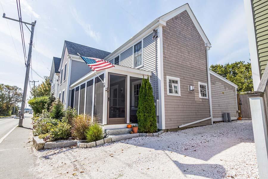 180 Commercial Street Wellfleet, MA 02667 - Photo 32 of 41 a front view of a house with garden