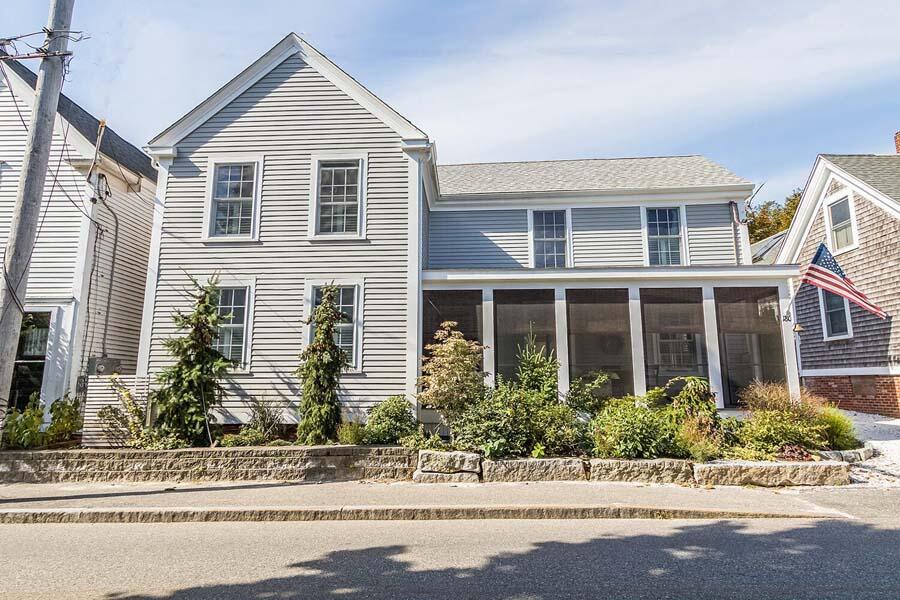 180 Commercial Street Wellfleet, MA 02667 - Photo 33 of 41 front view of a house and a yard