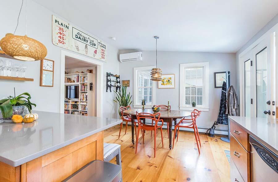 180 Commercial Street Wellfleet, MA 02667 - Photo 8 of 41 a view of a dining room with furniture and wooden floor
