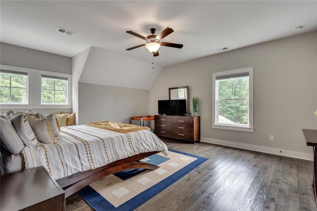 2503 Sugar Pike Road Canton, GA 30115 - Photo 106 of 134 a bedroom with a bed window and a flat screen tv