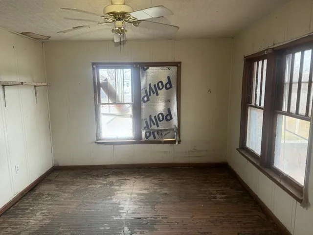 a view of an empty room with a window