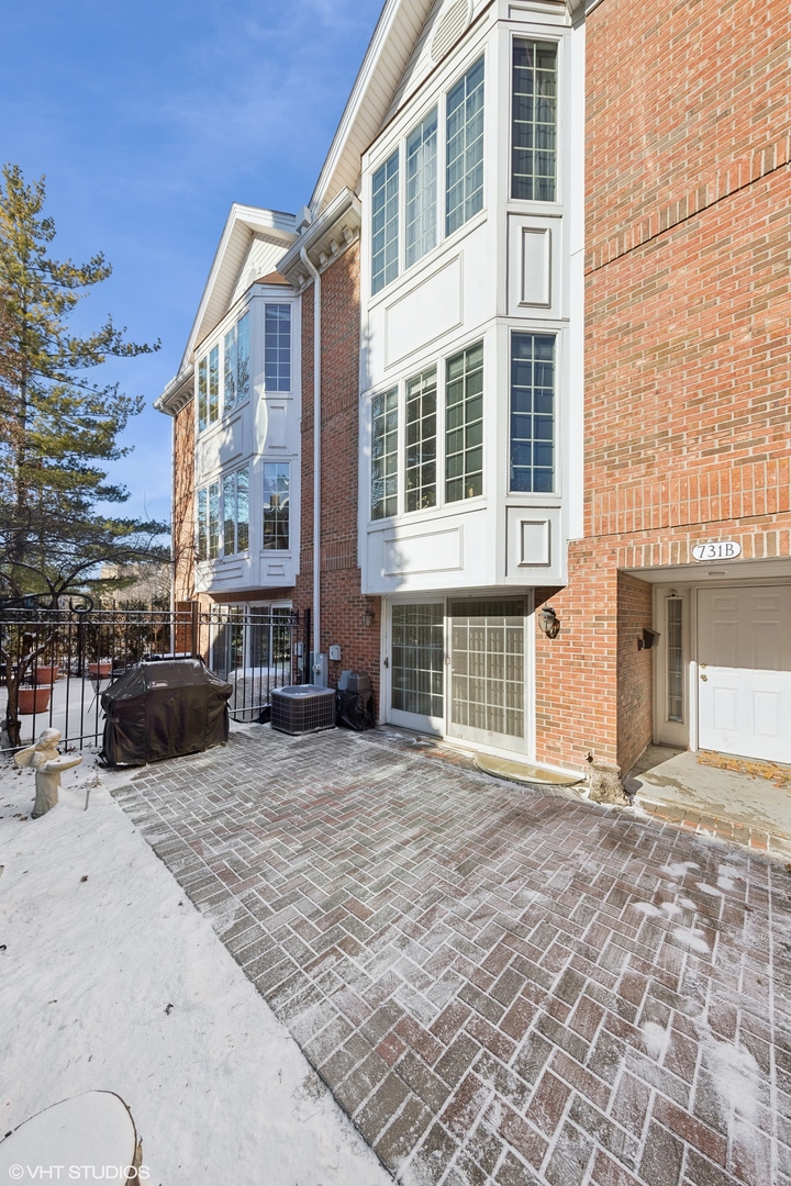 a view of a brick building with many windows