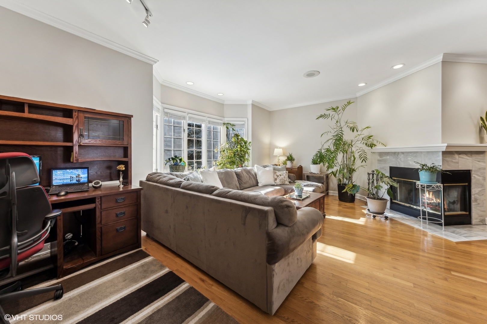 731 South Racine Avenue, Unit B Chicago, IL 60607 - Photo 14 of 29 a living room with furniture and a fireplace