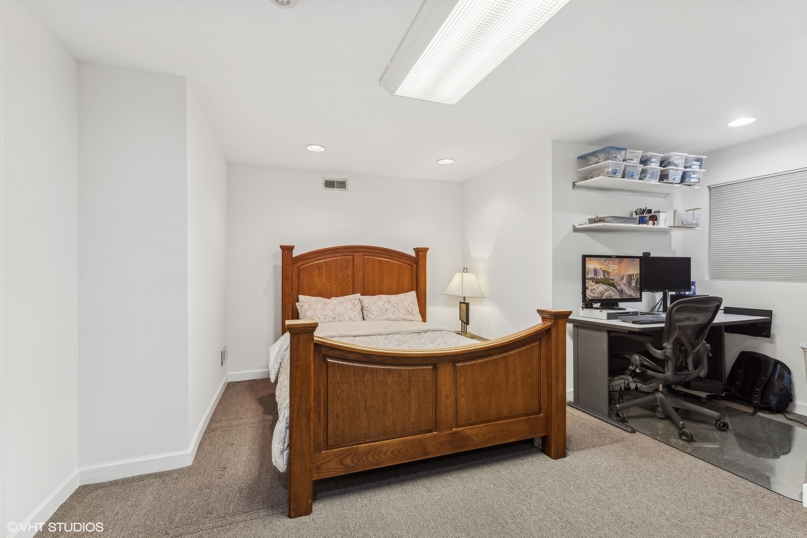 731 South Racine Avenue, Unit B Chicago, IL 60607 - Photo 21 of 29 a bedroom with a bed and a computer on it