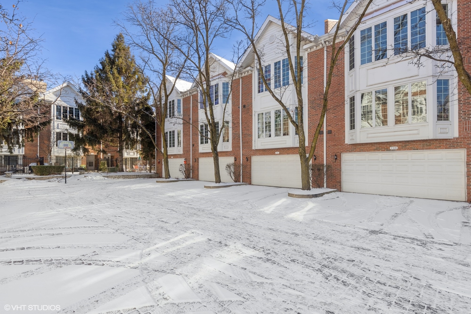 731 South Racine Avenue, Unit B Chicago, IL 60607 - Photo 23 of 29 a view of a building with snow on the road