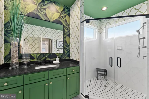 a bathroom with a sink a toilet and mirror
