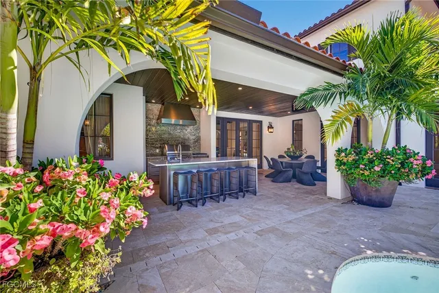 a view of a swimming pool with outdoor seating