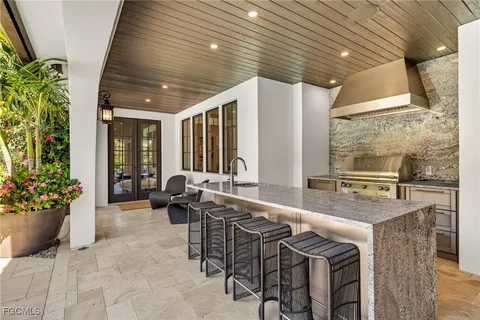 a lobby with furniture and potted plants
