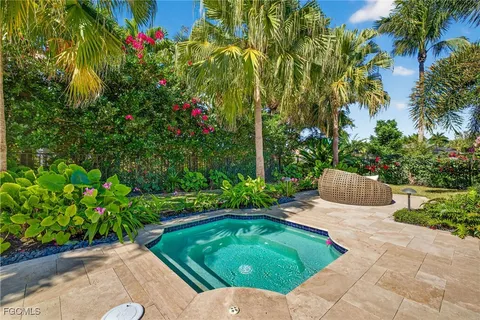 a view of a backyard with sitting area