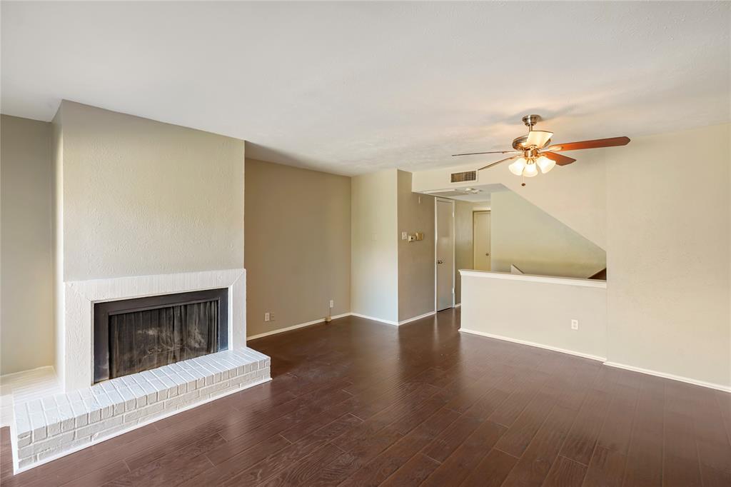 4523 North O'Connor Road, Unit 1177 Irving, TX 75062 - Photo 13 of 31 a view of an empty room with a fireplace